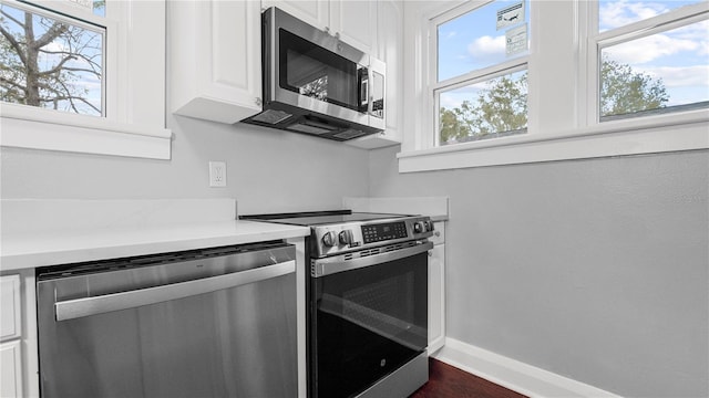 kitchen featuring white cabinets and stainless steel appliances