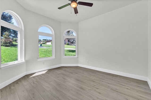 unfurnished room with light hardwood / wood-style floors and ceiling fan