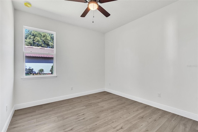 empty room featuring ceiling fan and light hardwood / wood-style floors