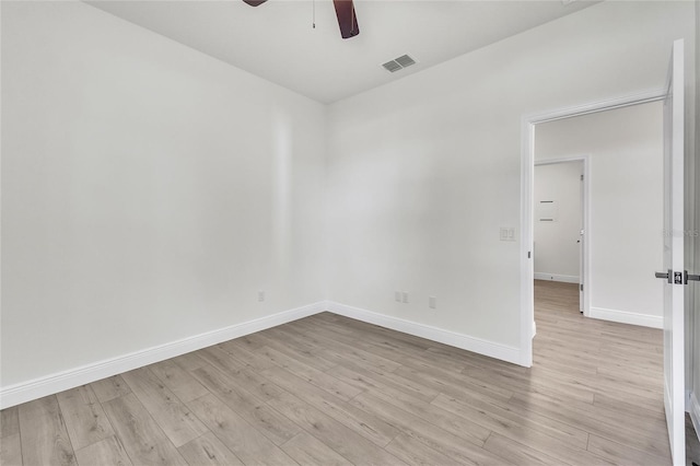 empty room with ceiling fan and light wood-type flooring