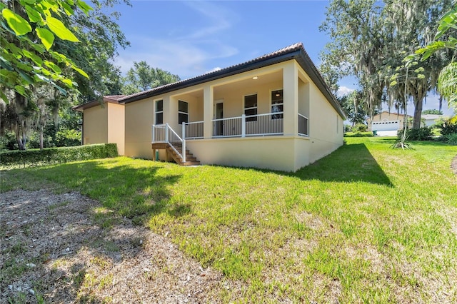 view of property exterior featuring a lawn