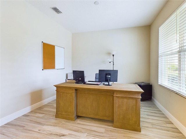 home office with light wood-type flooring