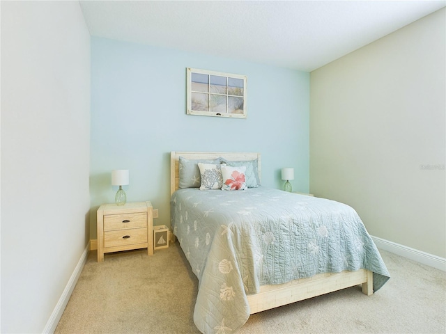 bedroom with light colored carpet