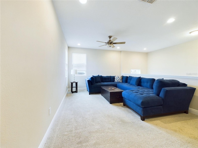 living room with ceiling fan and carpet floors