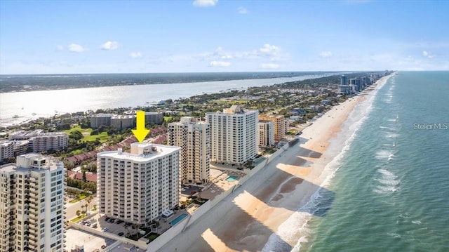 bird's eye view featuring a beach view and a water view