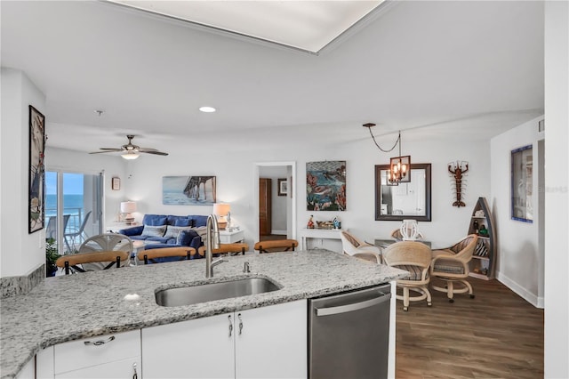 kitchen with dishwasher, sink, dark hardwood / wood-style floors, light stone counters, and white cabinetry