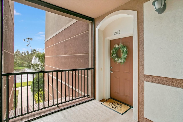 property entrance with a water view