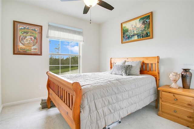 bedroom with light colored carpet and ceiling fan