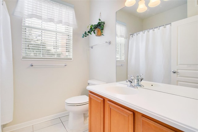 bathroom with tile patterned floors, vanity, and toilet