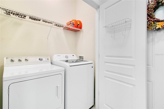 laundry area featuring independent washer and dryer