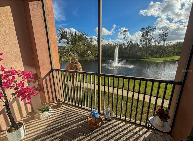 balcony featuring a water view