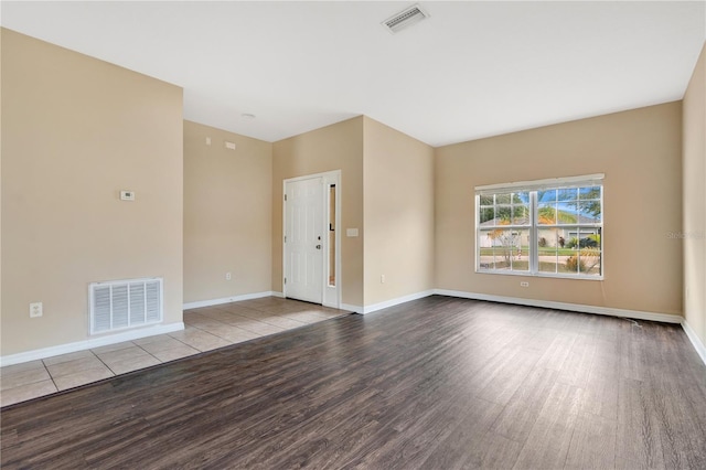 empty room with light hardwood / wood-style flooring