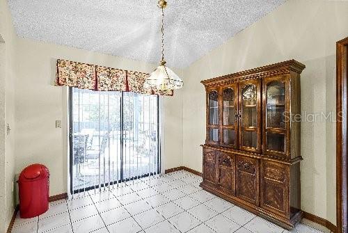 dining room featuring a textured ceiling