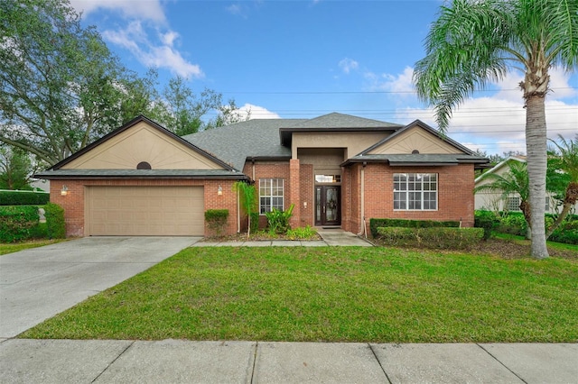 view of front of house featuring a garage and a front yard