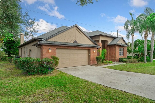 ranch-style home with a garage and a front lawn