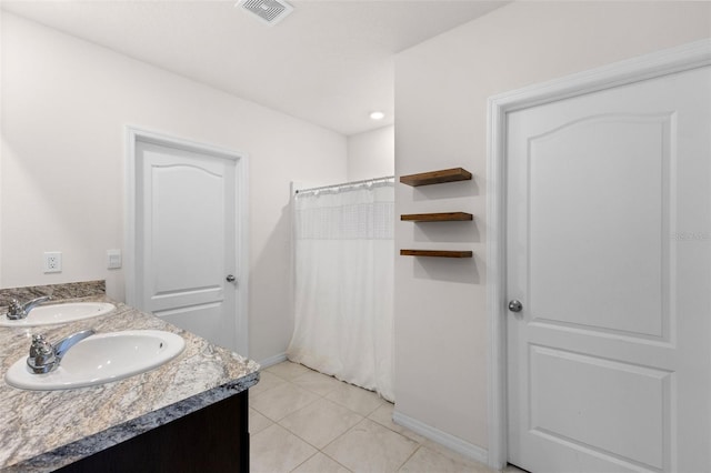 bathroom with tile patterned floors, a shower with curtain, and vanity