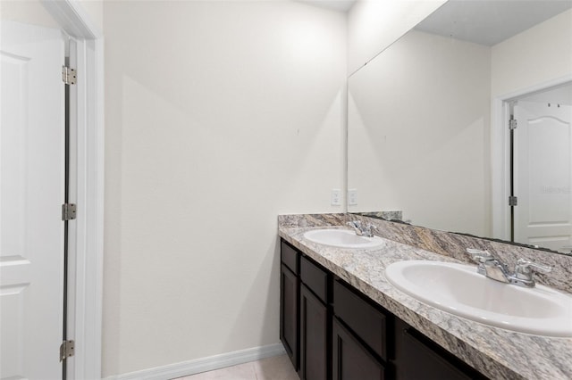 bathroom with tile patterned floors and vanity