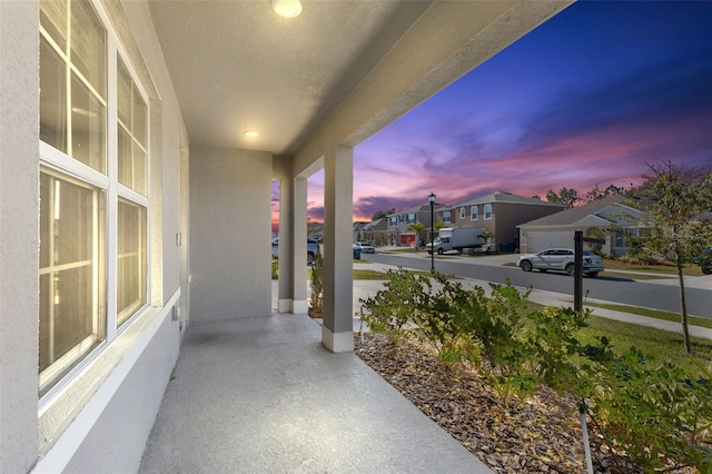 patio terrace at dusk with a porch