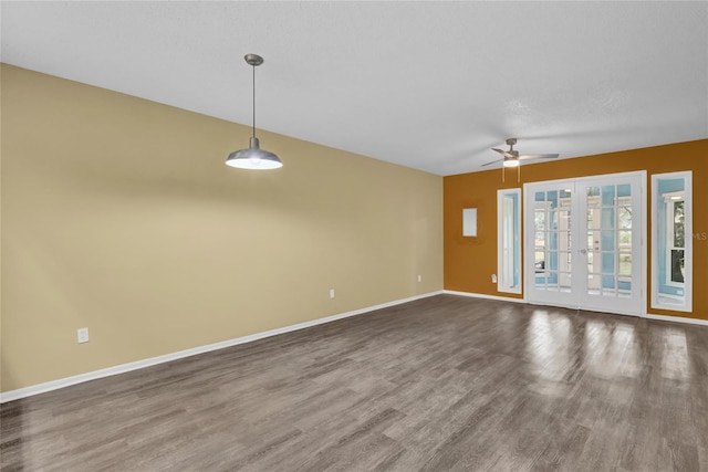 unfurnished living room featuring hardwood / wood-style floors, ceiling fan, a textured ceiling, and french doors