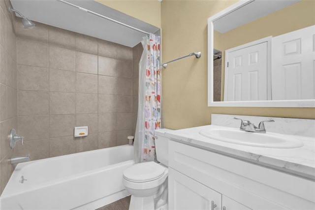 full bathroom featuring shower / bath combo with shower curtain, vanity, and toilet