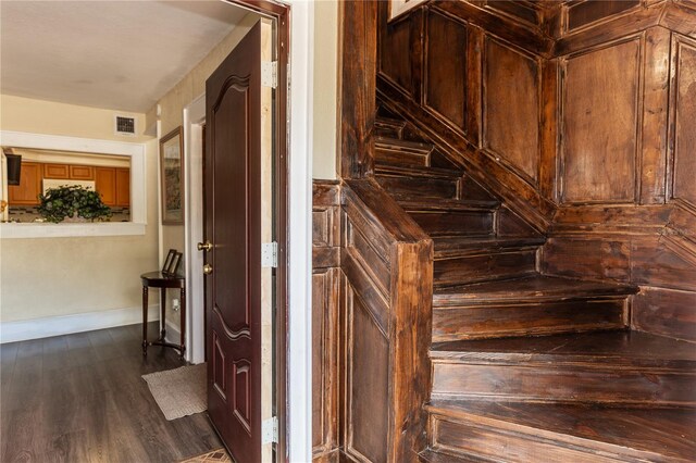 staircase featuring wood-type flooring