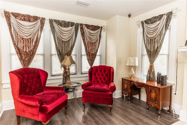 sitting room featuring dark hardwood / wood-style floors