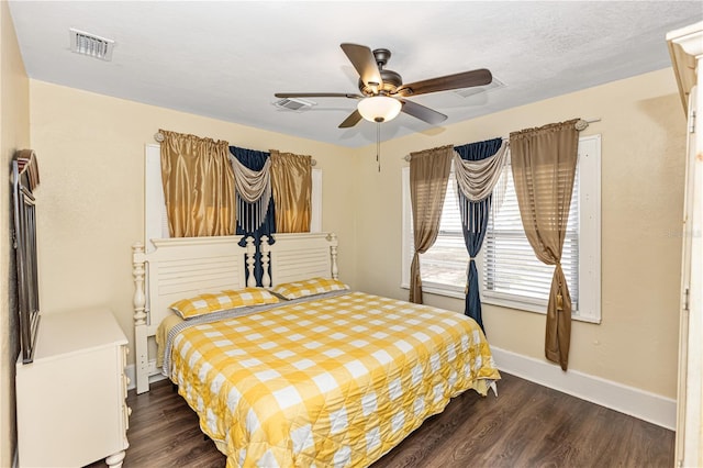 bedroom featuring ceiling fan and dark wood-type flooring