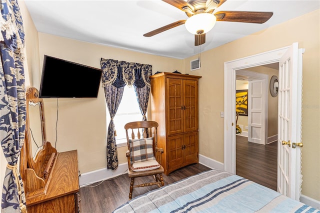 bedroom featuring ceiling fan and dark hardwood / wood-style flooring