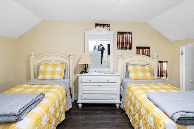 bedroom featuring dark hardwood / wood-style flooring and lofted ceiling