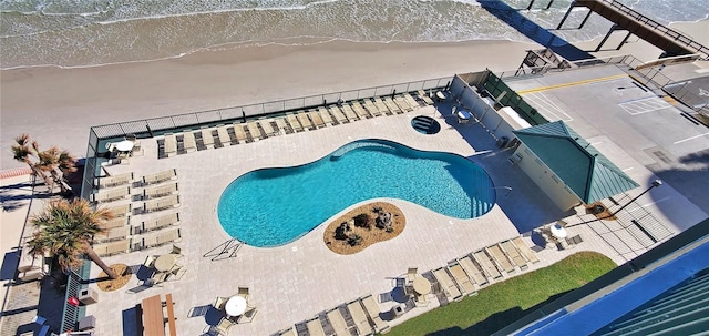 view of pool featuring a water view