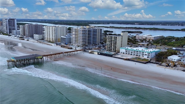 bird's eye view featuring a beach view and a water view