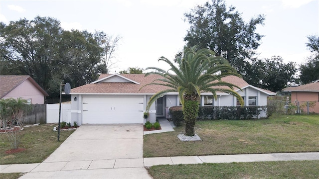 single story home featuring a front lawn and a garage