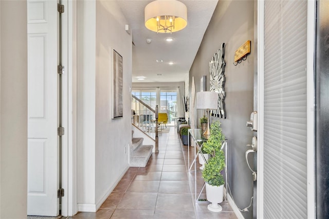 foyer with tile patterned flooring and a textured ceiling