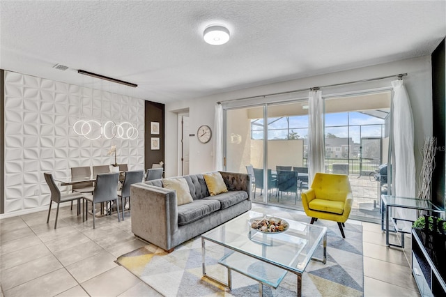 living room with light tile patterned floors and a textured ceiling