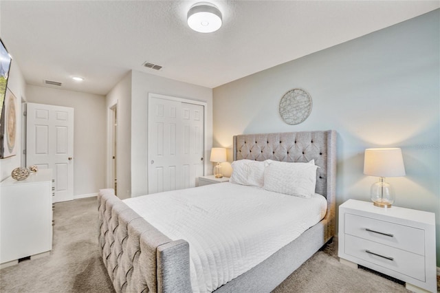 carpeted bedroom with a closet