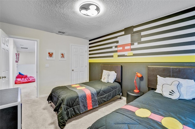 carpeted bedroom with a textured ceiling