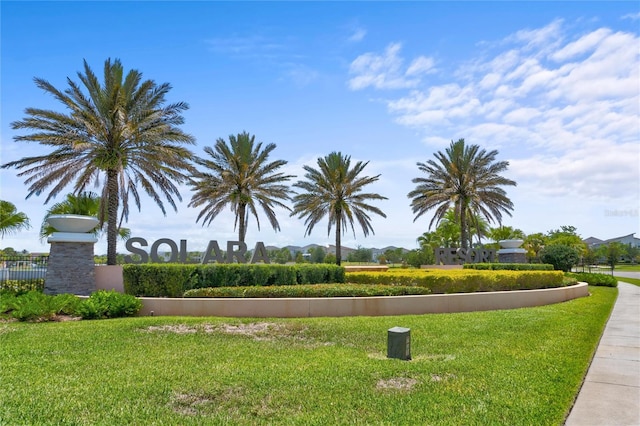 view of property's community with a yard