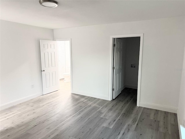 spare room featuring light hardwood / wood-style floors