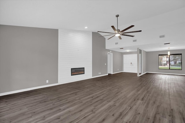 unfurnished living room with a fireplace, high vaulted ceiling, ceiling fan, and dark wood-type flooring