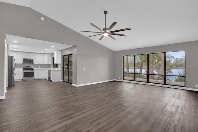 unfurnished living room featuring ceiling fan, dark hardwood / wood-style flooring, and high vaulted ceiling