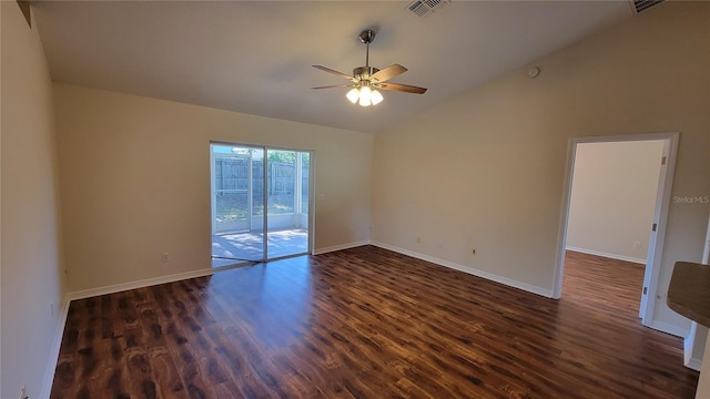 spare room with ceiling fan, dark wood-type flooring, and lofted ceiling