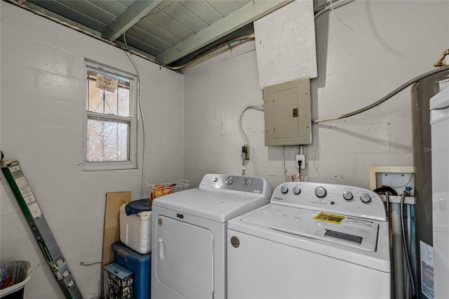 clothes washing area with electric panel and independent washer and dryer