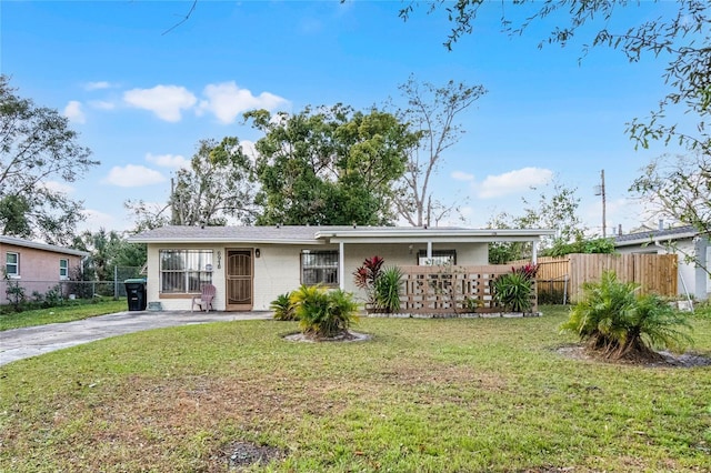 ranch-style home with a front lawn