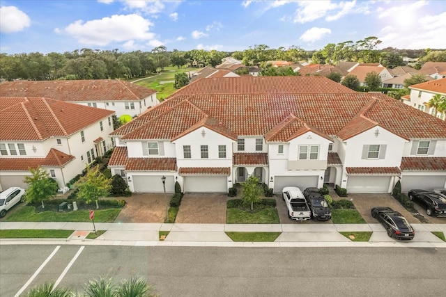 birds eye view of property with a residential view