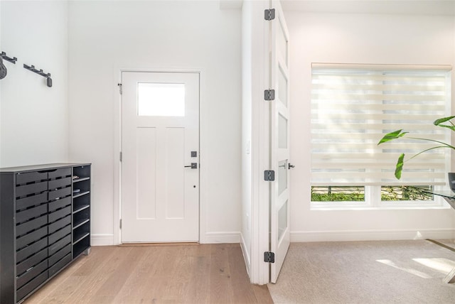 entrance foyer featuring a healthy amount of sunlight and light hardwood / wood-style floors