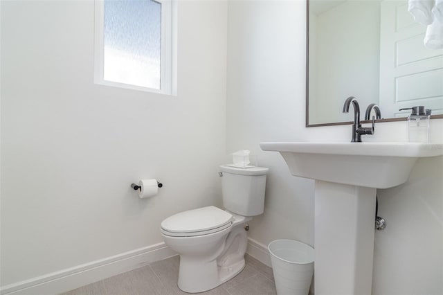 bathroom featuring toilet and tile patterned floors