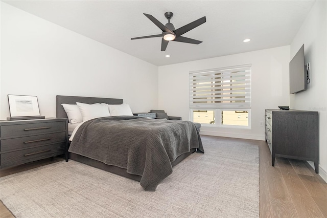 bedroom featuring ceiling fan and light wood-type flooring