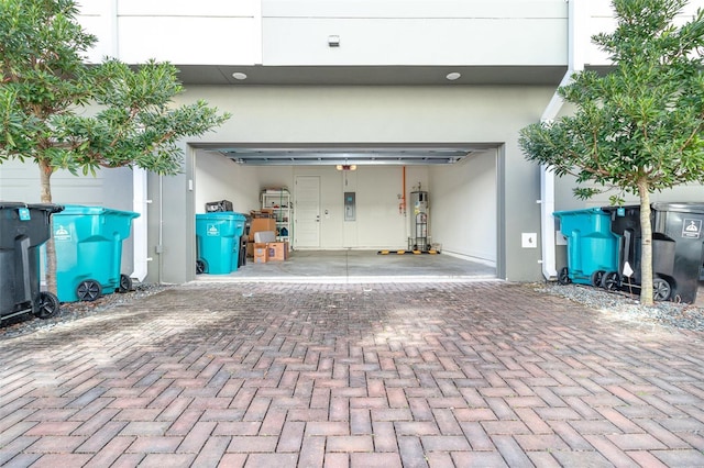 garage with water heater and electric panel