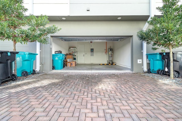 garage with water heater and electric panel