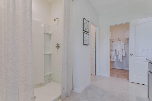 bathroom featuring vanity and a shower